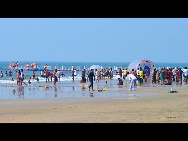 Sandy shoreline and sea views at Malpe Beach